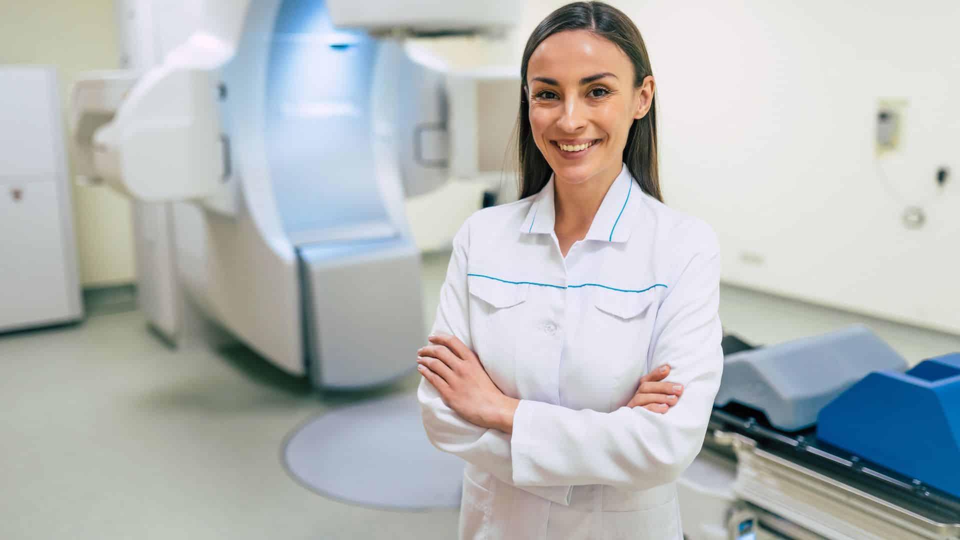 GTN medical technology field services technician in front of equipment